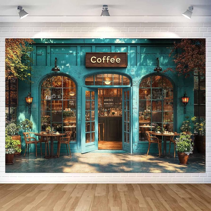 Teal coffee shop storefront with outdoor café tables